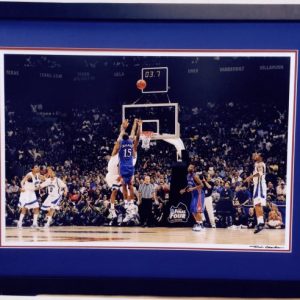 Framed Picture of Mario Chalmers taking a jumpshot while being defended with 3.7 seconds left on the clock, black frame with blue background