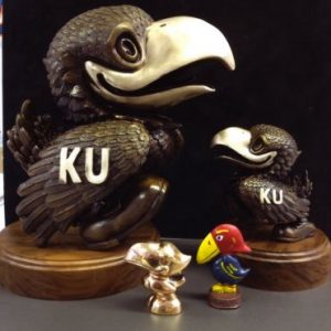 Four Jayhawk Figures 6" Tall and 2" Base - Two Jays with KU and Walnut Base, Two Smaller Jayhawks one Multicolored