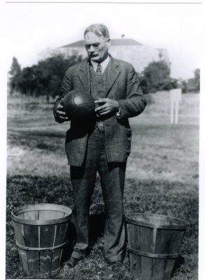 Black and White Photo James Naismith with Ball and Baskets