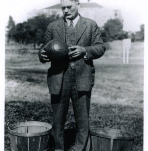 Black and White Photo James Naismith with Ball and Baskets
